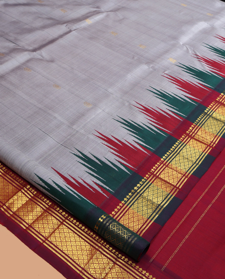 Grey Kanchipuram Silk Saree, Elevated with Zari Buttas, a Contrast One-Sided Border of Thazhampoo Rekku, Paneer Sombu, Banaras and Mayil Kann Design, Zari Design Pallu, and No Blouse
