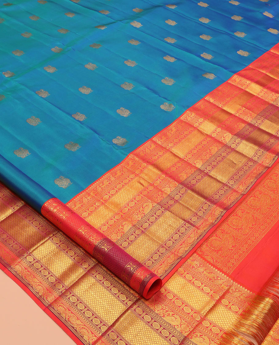 Blue Kanchipuram Silk Saree, Accentuated with Mayil Buttas, a Contrast Korvai Border of Thilakam Mokku, Yaali, Kamalam, Kuyil Kann, Mayil, and Dhavana Kodi, Jaal Pallu, and a Contrast Blouse