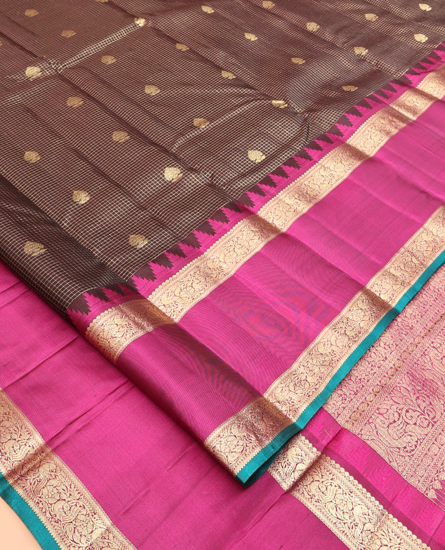 Brown Vasundhara Silk Saree, Elegantly Highlighted with Zari Buttas and Checks, a Contrast Temple Rettai Pettu Border of Thilakam Mokku, and Mayil, Intricate Pallu, and a Contrast Blouse