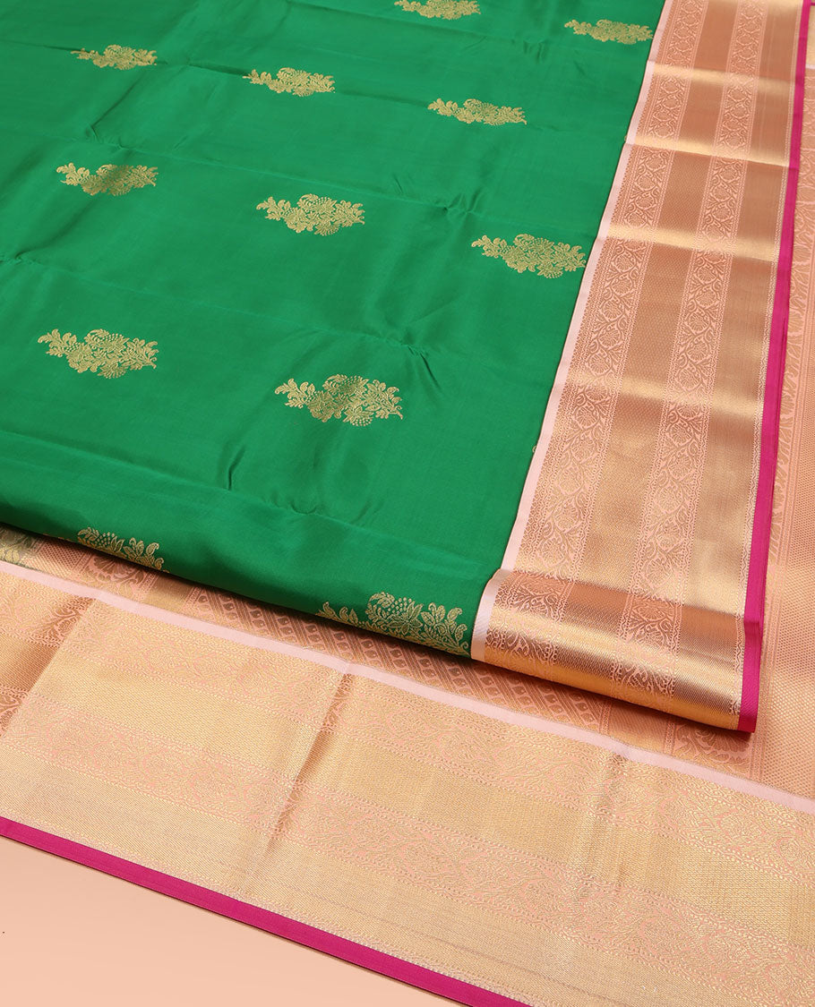 Green Vasundhara Lite Silk Mix Saree, Accentuated with Zari Buttas All Over Its Body, Complemented by a Contrast Border of Muthu, Kodi Visiry, and Mayil Kann Designs, Pallu Steeped with Stripes and Thilakam Designs, and Paired with a Contrast Blouse