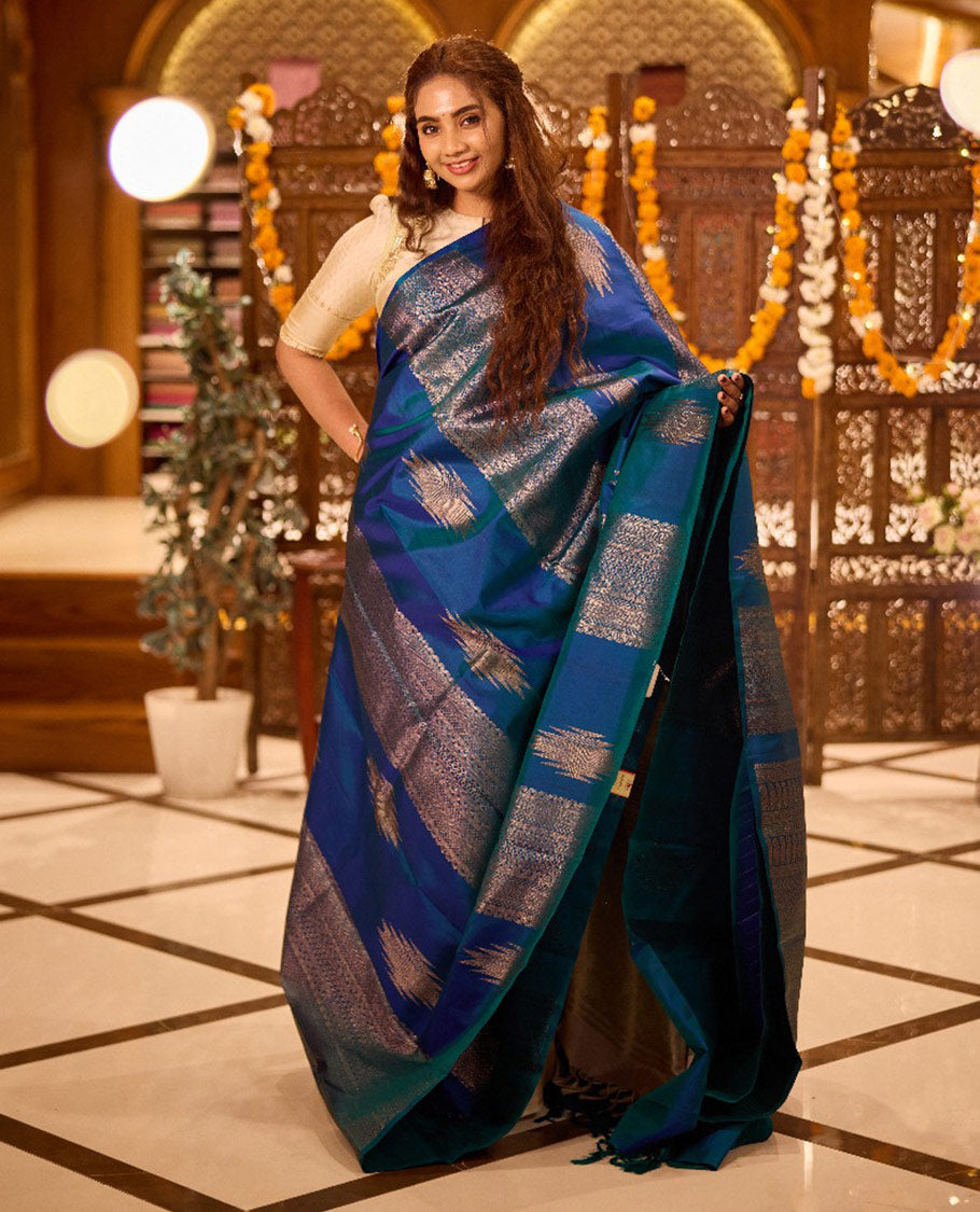 Borderless peacock blue thazampoo rekku, and geometric patterns zari woven Kanchipuram silk saree, zari pallu of manga and paiyaadi kattam designs