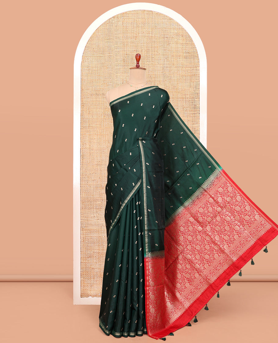 Bottle Green Satin Silk Saree, Enriched with Buttas All Over Its Body, a Subtle Piping Border, Complemented by a Contrast Pallu of Floral-Paisley Designs in Zari, and Paired with a Contrast Blouse