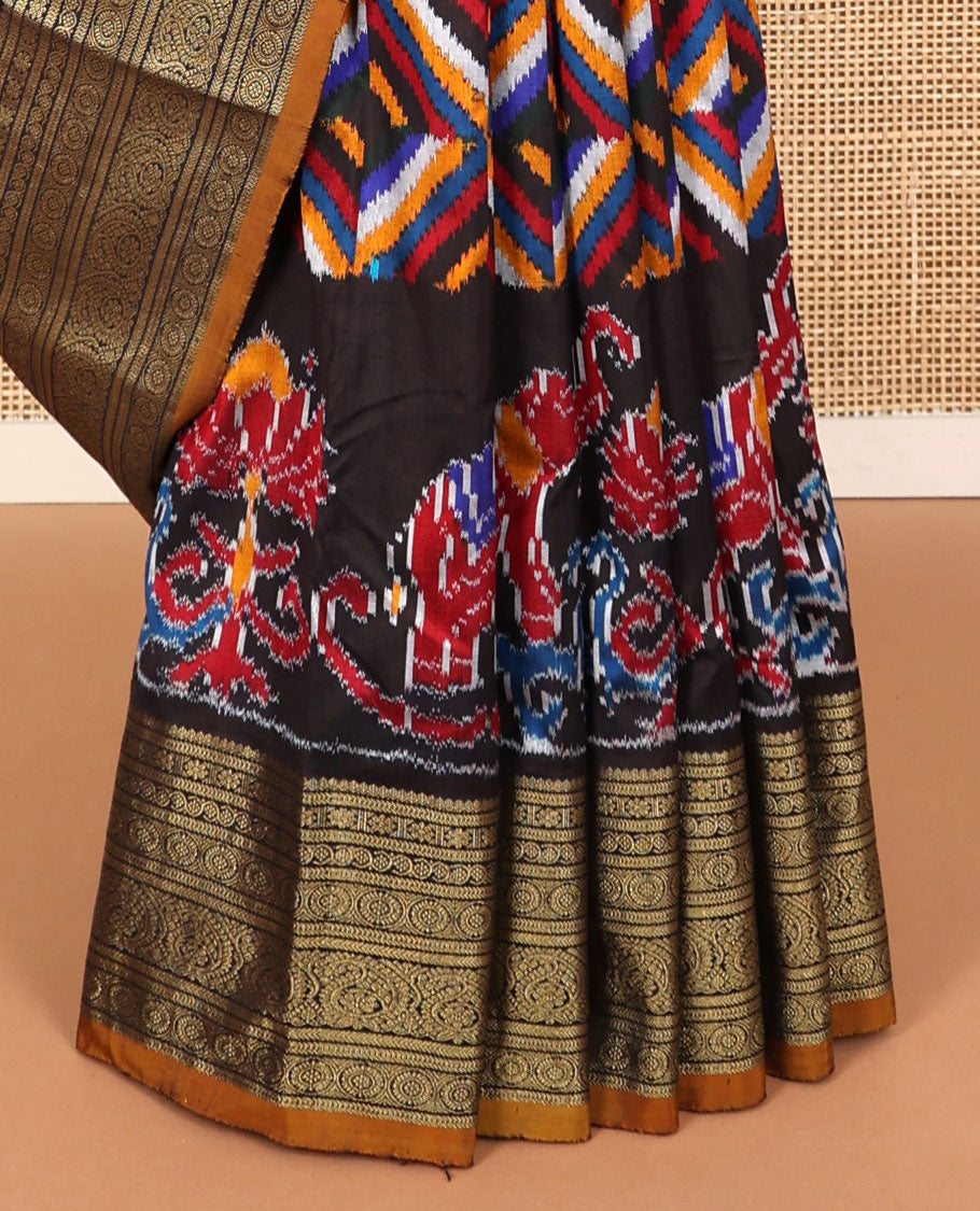 Black geometric, floral & animal design ikkat saree with contrast zari design border & traditional zari design pallu