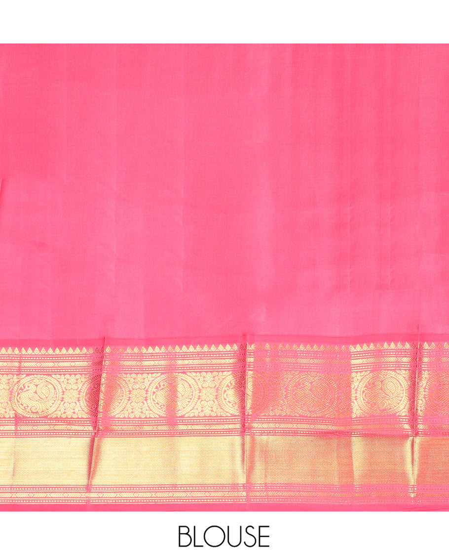 Green Vasundhara Silk Saree, Elevated with Mayil Zari Buttas All Over Its Body, Complemented by a Contrast Border of Thilakam Mokku, Kathir, and Round Mayil Designs, Grand Jaal Pallu, and Paired with a Contrast Blouse