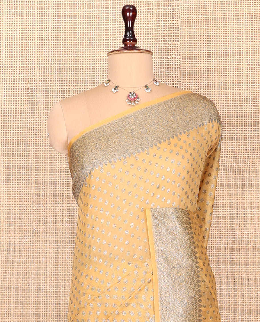 Yellow Georgette Saree, Steeped with Buttas, Highlighted by a Traditional Border, Intricately Designed Pallu, and a Matching Blouse