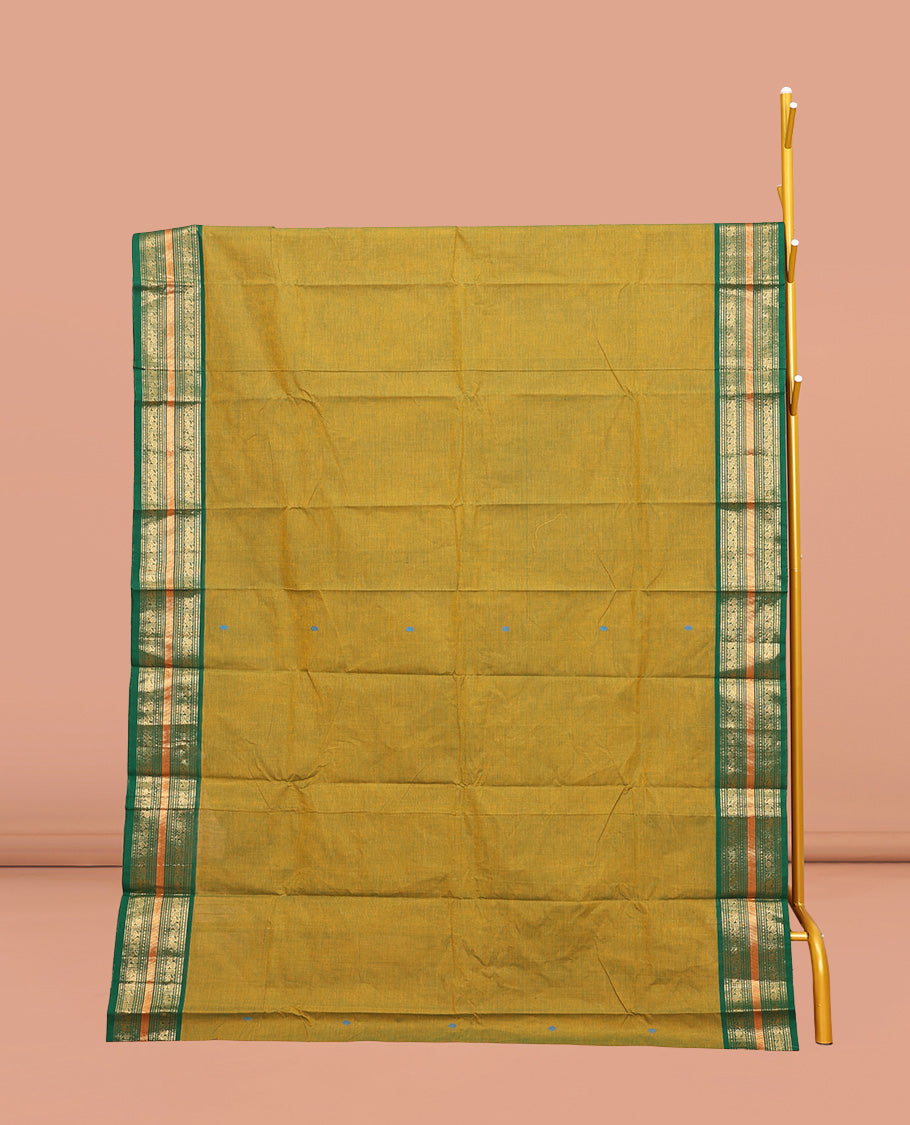 Green Chettinad Cotton Saree, Subtly Woven with Thread Buttas All Over Its Body, Complemented by Contrast Traditional Zari Design Border, Pallu of Stripes, and Buttas and Paired with a Matching Blouse