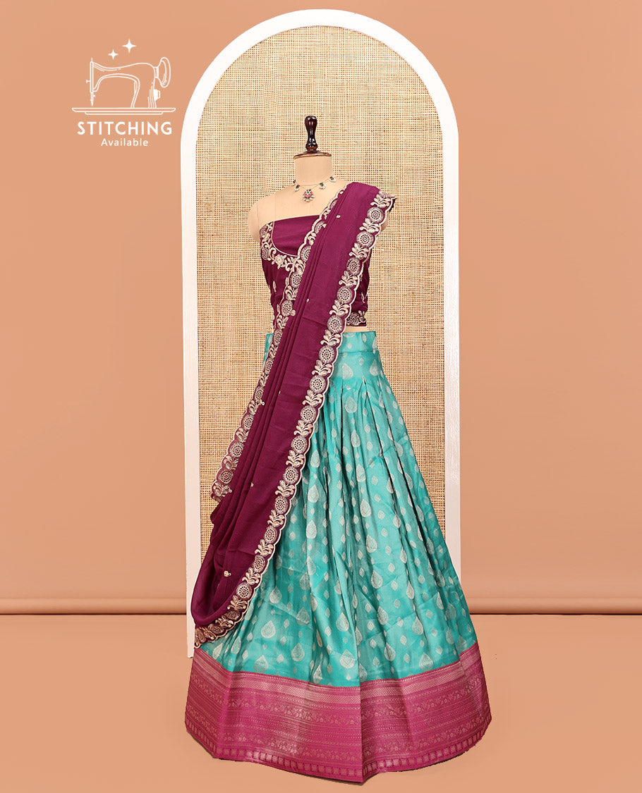Green Art Silk Half Saree Features Buttas Steeped Skirt, Complemented by Contrast Traditional Border, Contrast Blouse, and a Embroidery Scallop Dhavani