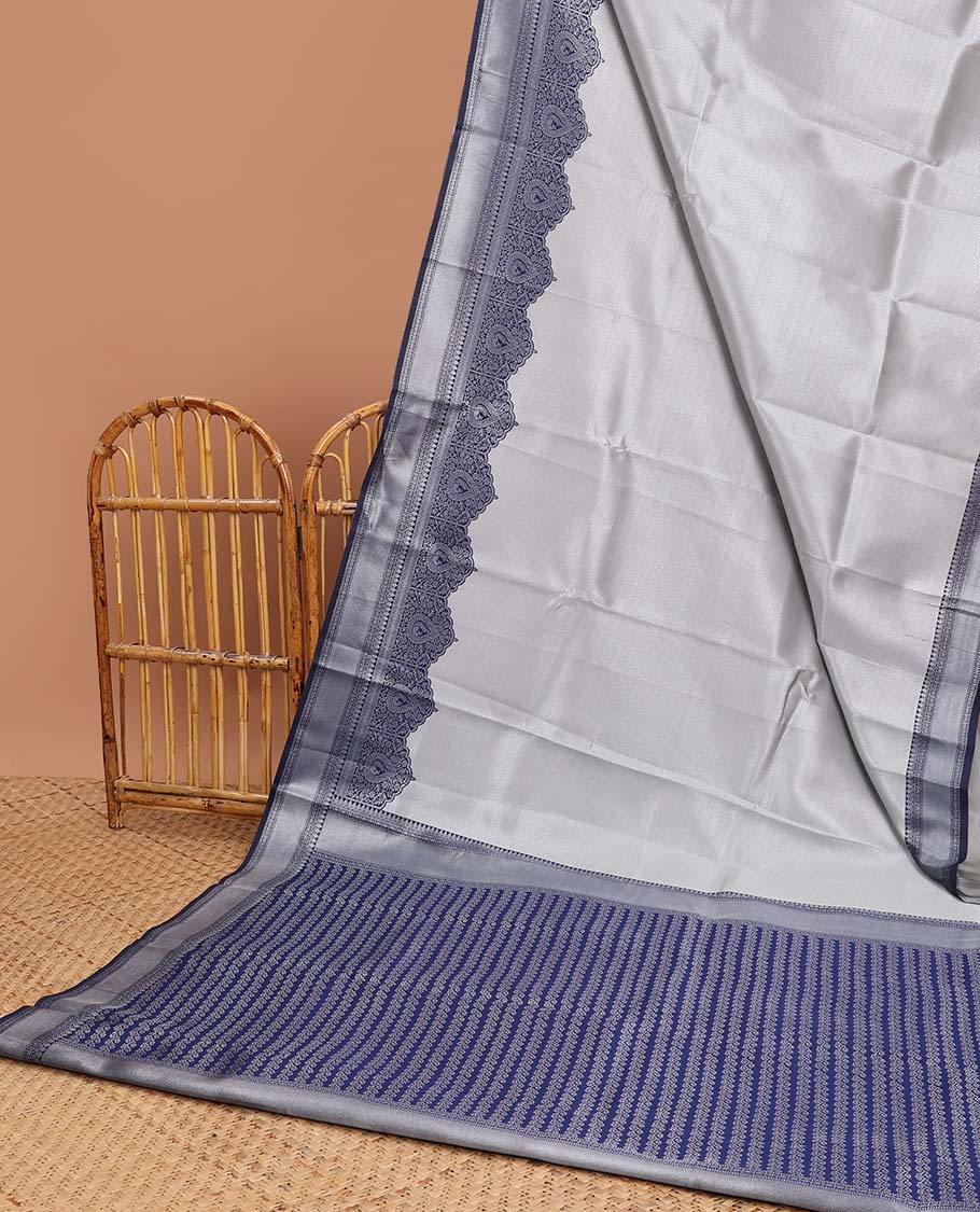 Grey checked design litchi silk saree with contrast floral design border & leaf vine design pallu