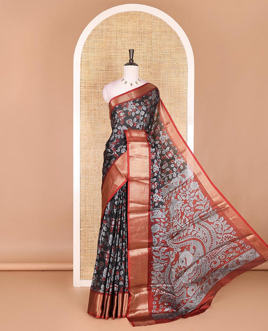 Black Kalamkari floral vine and peacock printed dola silk saree, contrast traditional zari border, peacock printed pallu, and floral vine print blouse