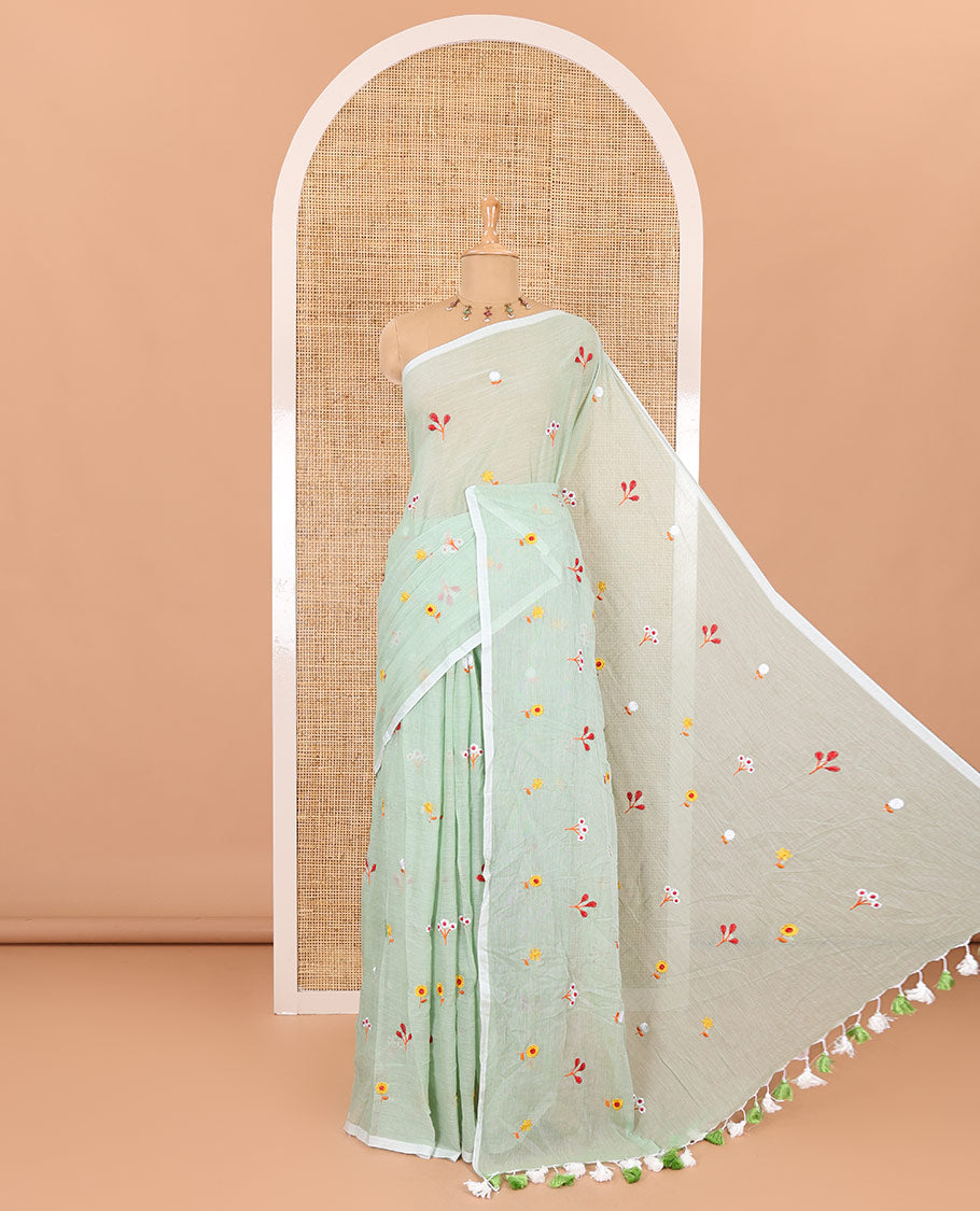 Borderless pista green floral motifs thread embroidered khadi mul cotton saree, floral motifs thread embroidered pallu, and a matching plain blouse