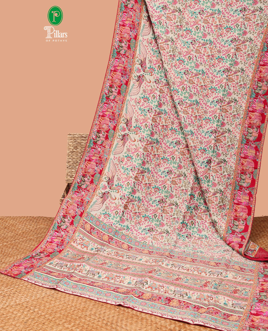 Cream with rani pink all-over postion print dola silk saree contrast elephant print border & postion printed rich pallu along with contrast brocade blouse