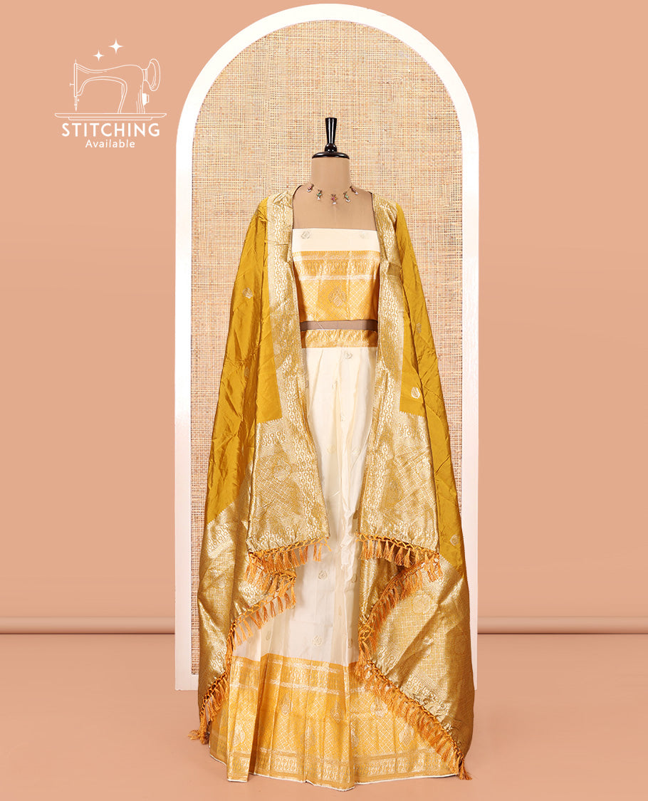 Cream-Yellow Semi-Banarasi Half-Saree Set Featuring Buttas Skirt, Contrast Traditional Border, Matching Blouse, and Banaras Dhavani