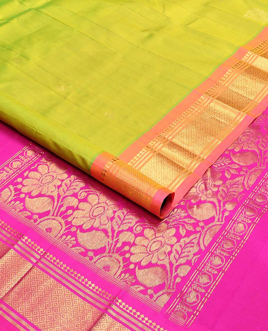 Light green buttas kancheepuram silk saree with contrast border of thilakam moku, banaras, kuyil kann design & zari design pallu