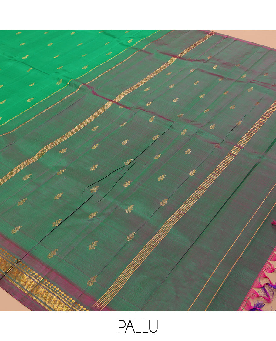Green Kanchipuram Silk Saree, Woven with Zari Buttas, a Contrast One-Sided Border of Panner Sombu, Banaras, and Mayil Kann Designs, Zari Design Pallu, and No Blouse