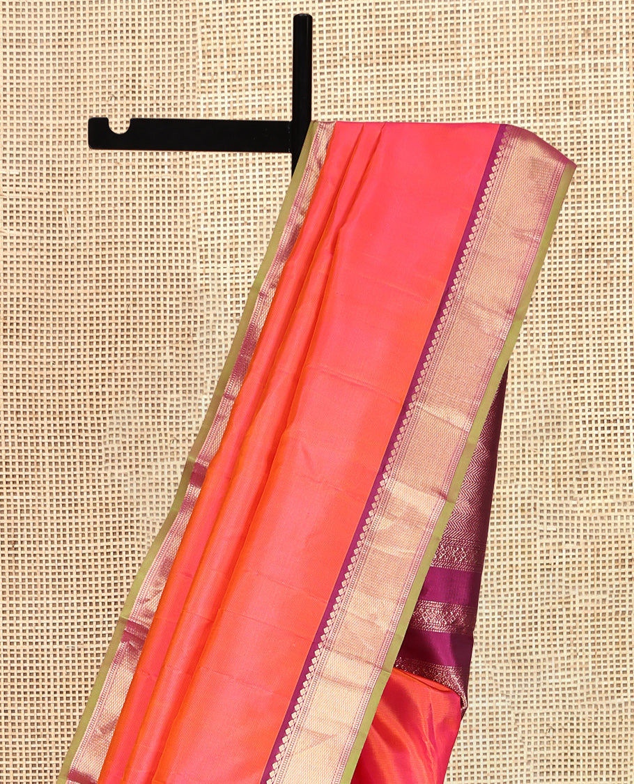 Orange Plain Kanchipuram Silk Saree, a Contrast Border of Thilakam Mokku, Banaras, Muthu, and Mayil Kann Designs, Intricately Patterned Pallu, and a Contrast Blouse