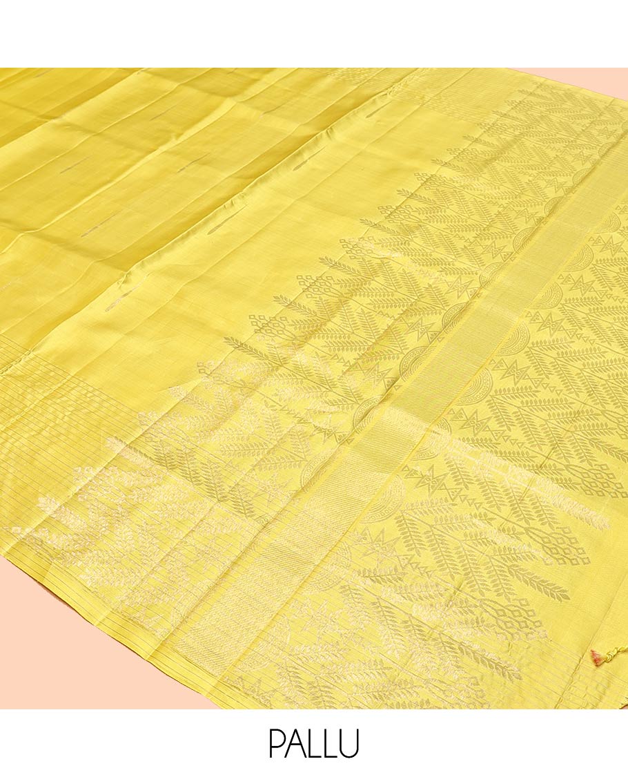 Yellow Mayuri Soft Silk Saree, Sparsely Sparkled with Malli Mokku Buttas All Over Its Body, Highlighted by Zari Striped Border, Pallu of Intricate Designs, and Paired with a Matching Blouse