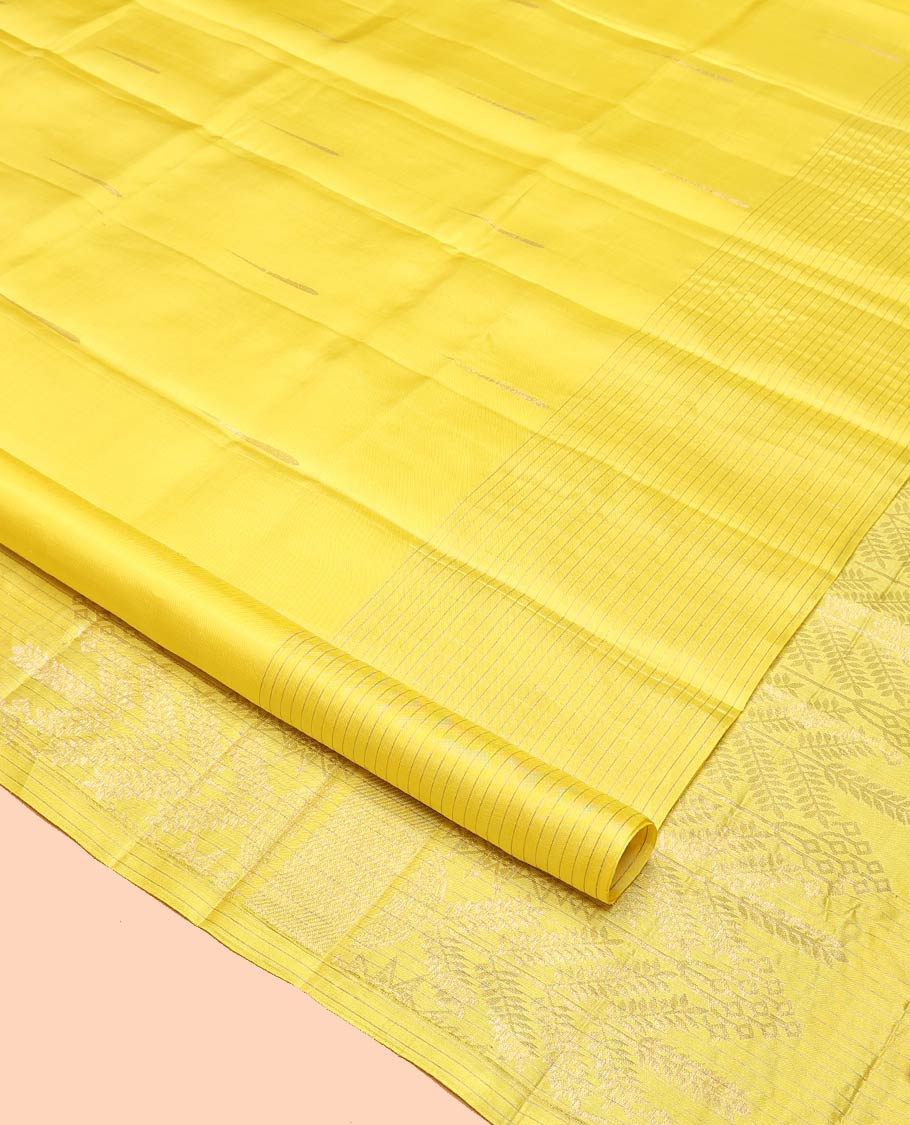 Yellow Mayuri Soft Silk Saree, Sparsely Sparkled with Malli Mokku Buttas All Over Its Body, Highlighted by Zari Striped Border, Pallu of Intricate Designs, and Paired with a Matching Blouse