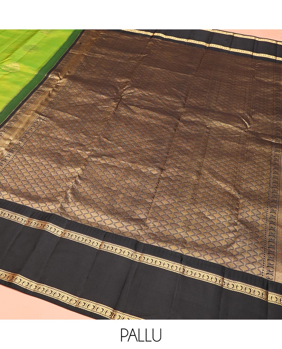 Green Vasundhara Silk Saree, Detailed with Zari Buttas on Its Body, Complemented by Contrast Temple Border of Banaras, Kathir, and Manga Designs, Grandly Woven Jaal Pallu, and Paired with a Contrast Blouse