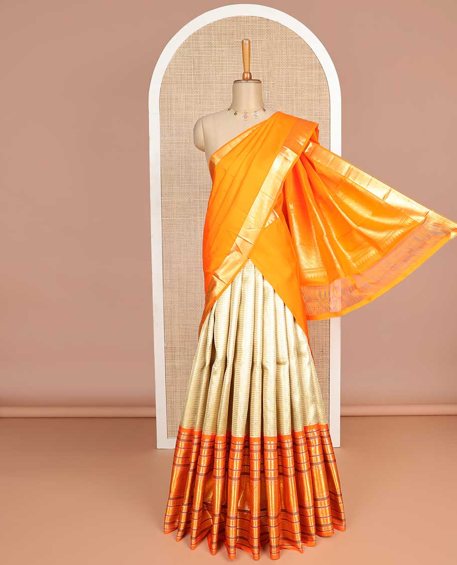 Light yellow striped silk half saree with contrast border of banaras, kathir, poo chakram, mayil design, zari design blouse & intricate zari design dhavani