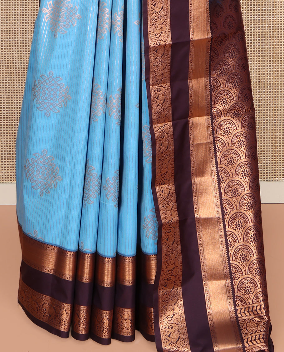 Blue Budget Silk Saree, Embellished with Zari Stripes and Kolam Buttas All Over Its Body, Complemented by a Contrast Traditional Zari Design Rettai Pettu Border, Grand Scallop Design Pallu, and Paired with a Contrast Blouse