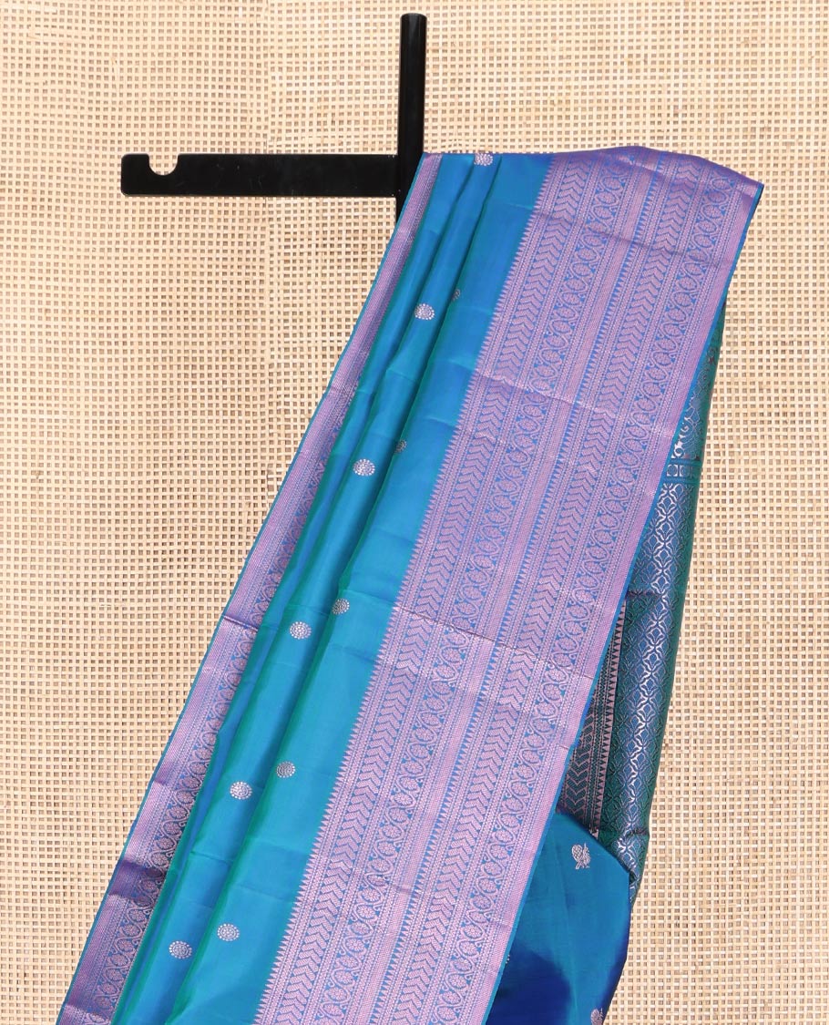 Blue Kanchipuram Silk Saree, Graced with Mayil and Chakram Thread Buttas on Its Body, Highlighted by a Self-Border of Rekku, Neli, Kathir, and Kodi Visiry Designs, Pallu of Jaal Designs, and Paired with a Matching Blouse