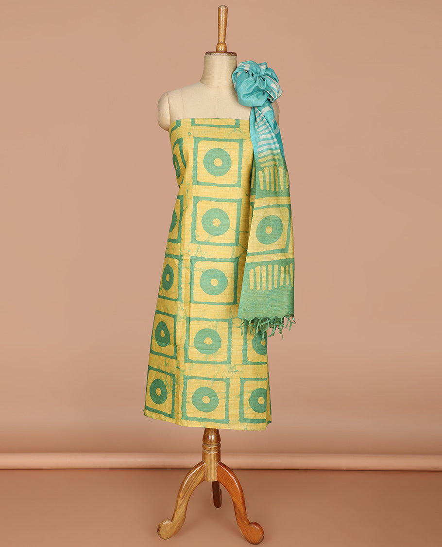 Lemon yellow with green geometric batik print bhagalpur cotton chudidhar material top with batik print cotton pants & batik print mul mul dupatta