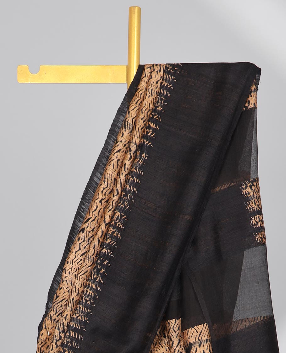 Light brown abstract design matka silk saree with contrast plain border & black abstract design pallu