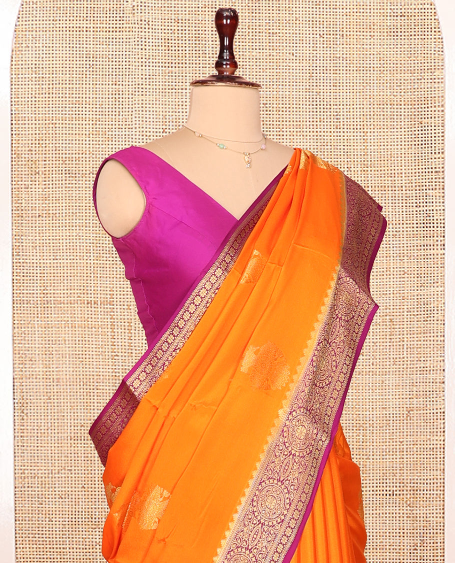 Orange Mysore Silk Saree, Bedecked with Zari Buttas All Over Its Body, Complemented by Captivating Contrast Border of Traditional Zari Designs, Gleaming Zari Striped Pallu, and Paired with a Contrast Blouse