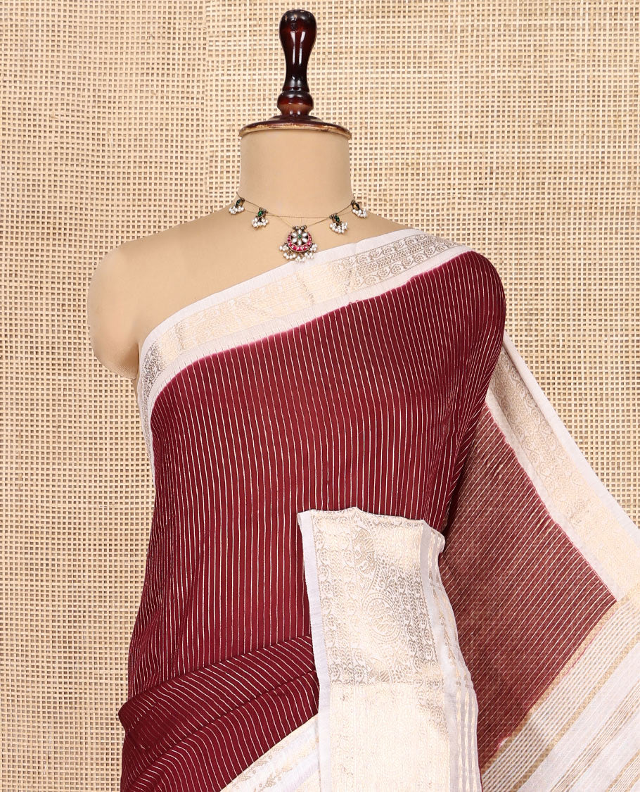 Maroon Assam Silk Saree, Steeped with Zari Stripes, a Contrast Traditional Zari Design Border, a Pallu Steeped with Zari Stripes, and a Contrast Blouse