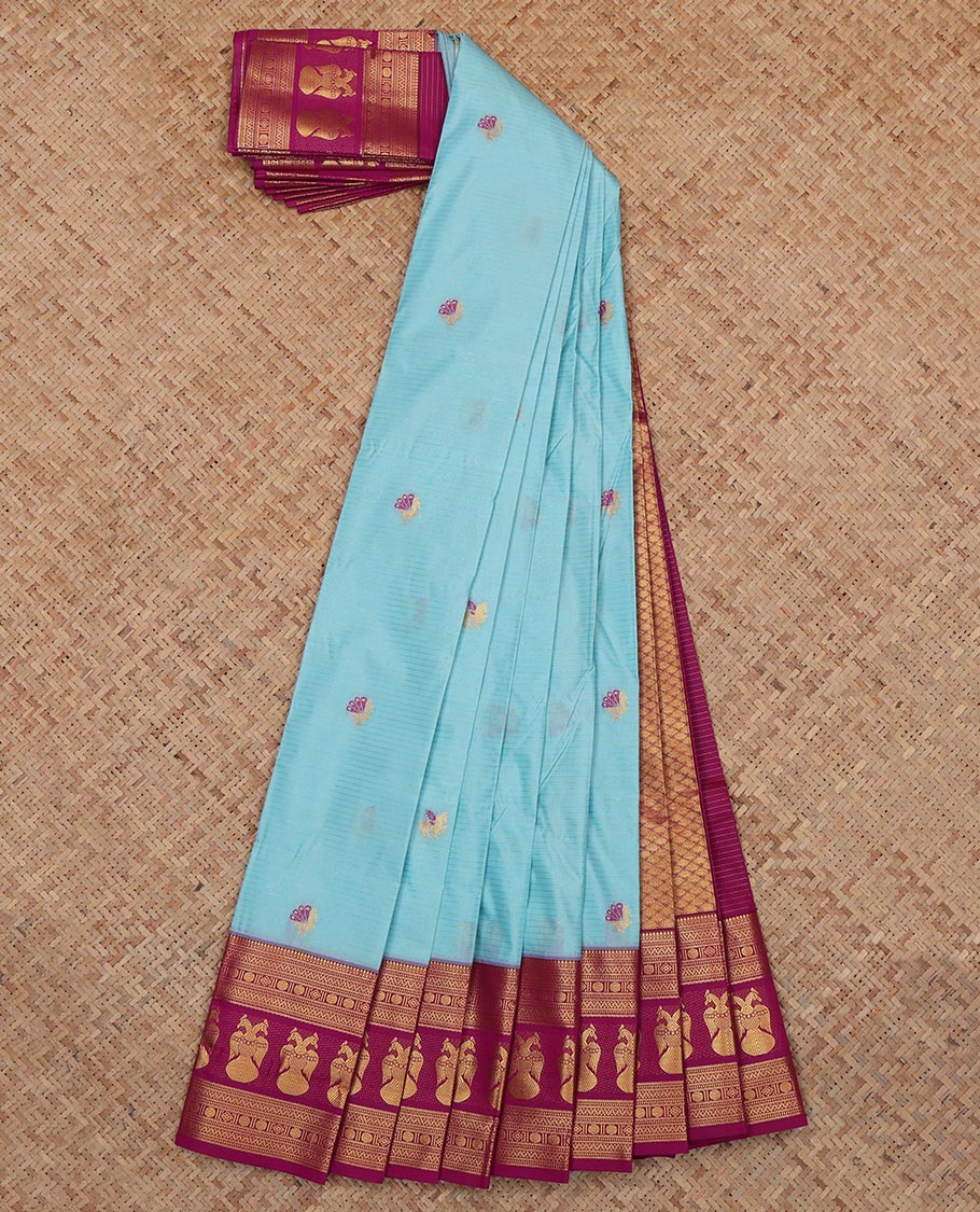Blue Budget Silk Saree, Embelished with Horse Buttas and Stripes, a Contrast Iruthalai Pakshi Zari Border, a Jaal Pallu and a Contrast Blouse