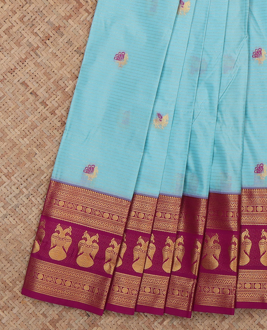 Blue Budget Silk Saree, Embelished with Horse Buttas and Stripes, a Contrast Iruthalai Pakshi Zari Border, a Jaal Pallu and a Contrast Blouse