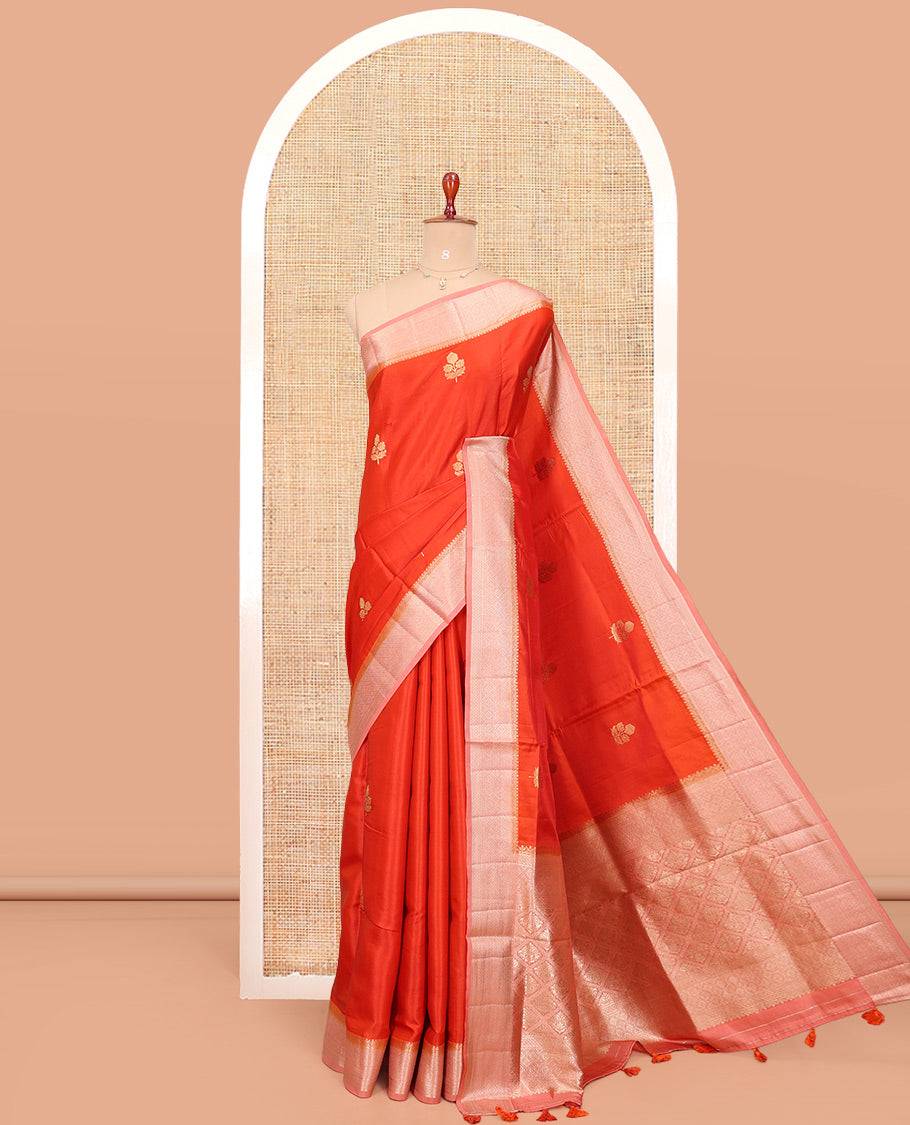 Orange Satin Silk Saree, Delicately Woven with Floral Buttas All Over Its Body, Complemented by a Contrast Border of Jaal Designs, Pallu of Jaal Designs in Zari, and Paired with a Contrast Blouse