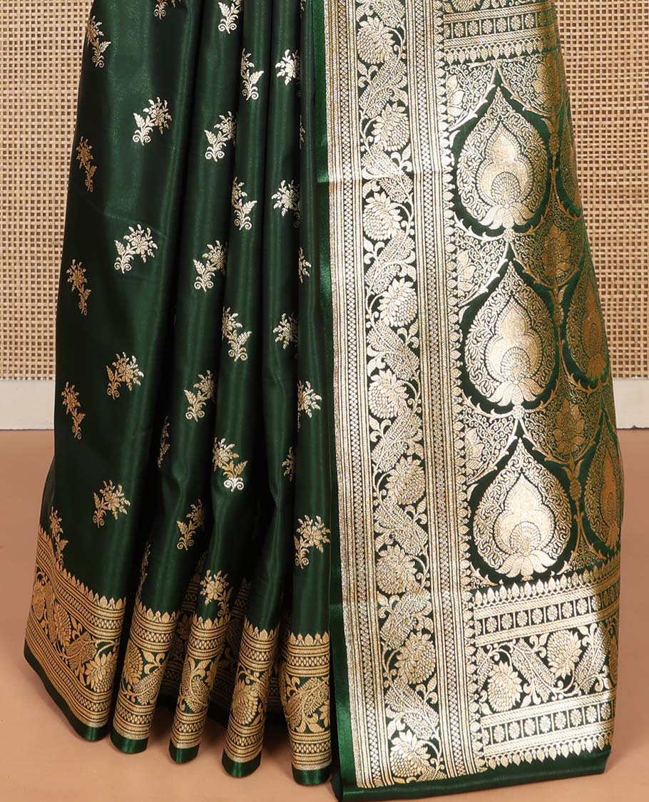 Green Semi-Banaras Saree, Spotlighted with Floral Buttas on Its Body, Highlighted by a Floral Creeper Border, Intricately Designed Pallu, and Paired with a Matching Blouse