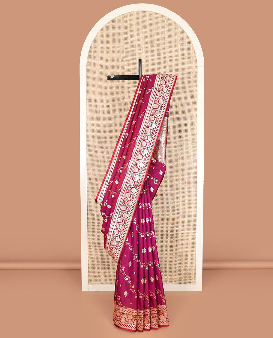 Magenta zari buttas banarasi silk saree, floral creeper design border, and intricate Mughal-style woven pallu