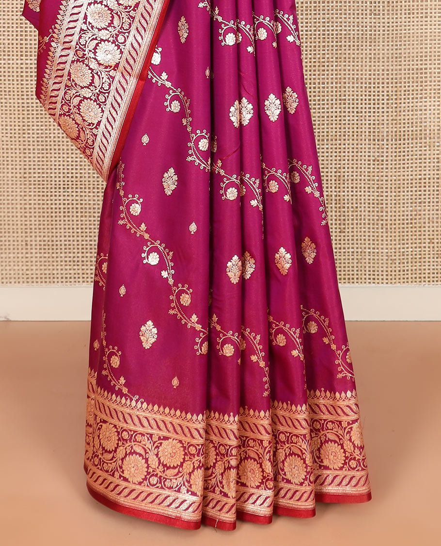 Magenta zari buttas banarasi silk saree, floral creeper design border, and intricate Mughal-style woven pallu