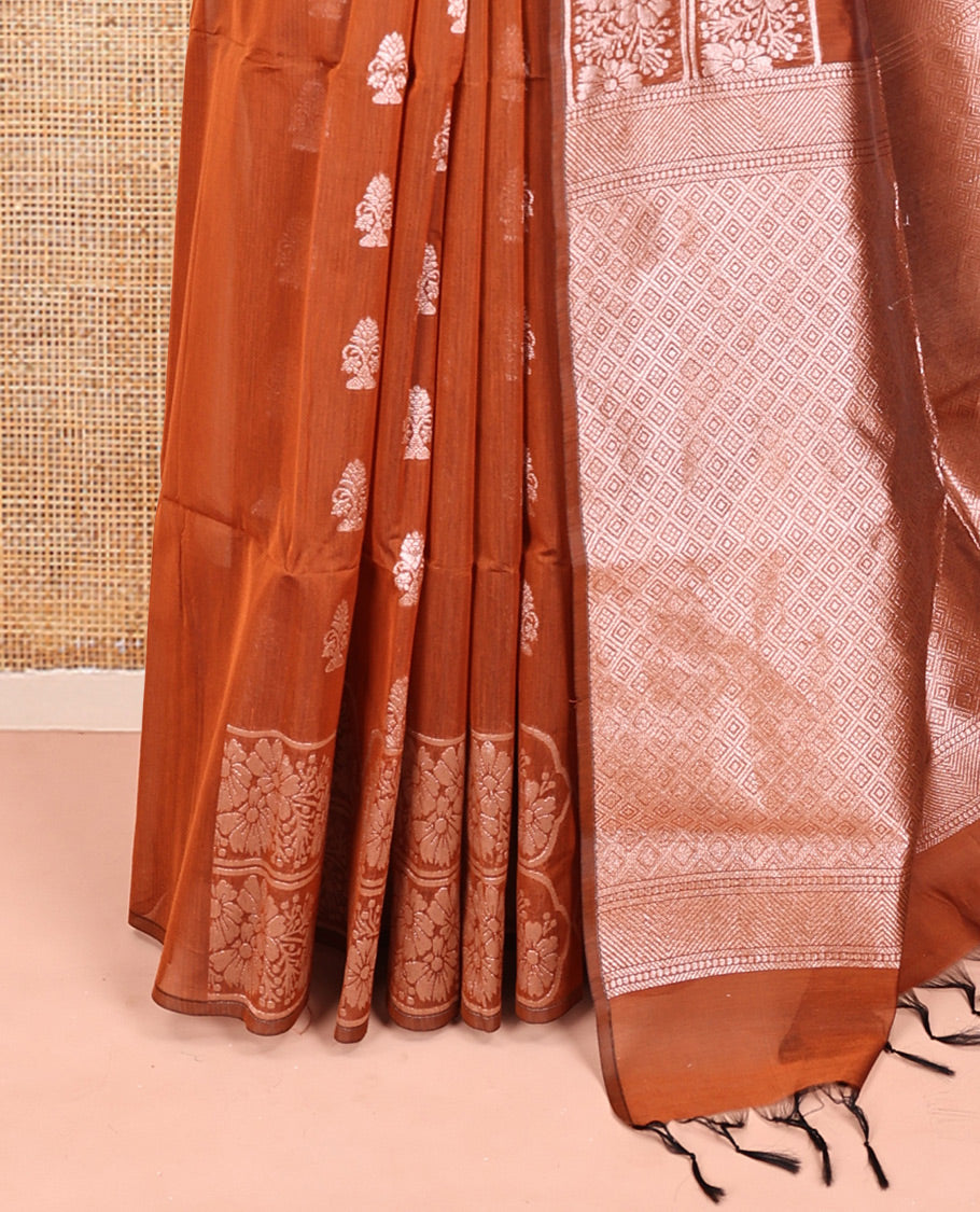 Rust Orange Semi-Silk Cotton Saree, Gleamed Up with Zari Buttas All Over Its Body, a Subtle Border of Floral Designs, Grand Jaal Pallu, and Paired with a Matching Blouse