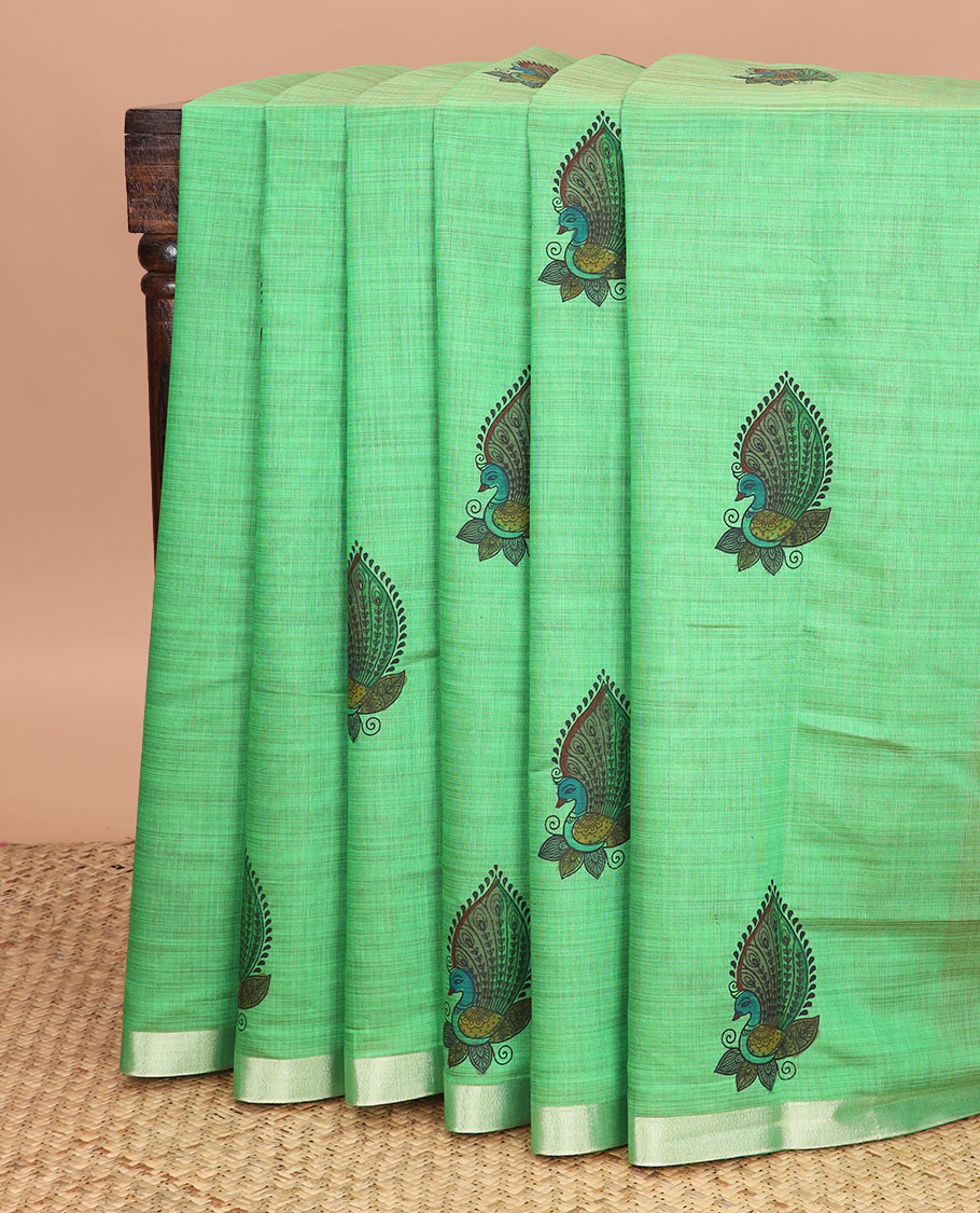 Green peacock buttas printed chirala cotton saree, bavanji border, and contrast floral motifs pallu