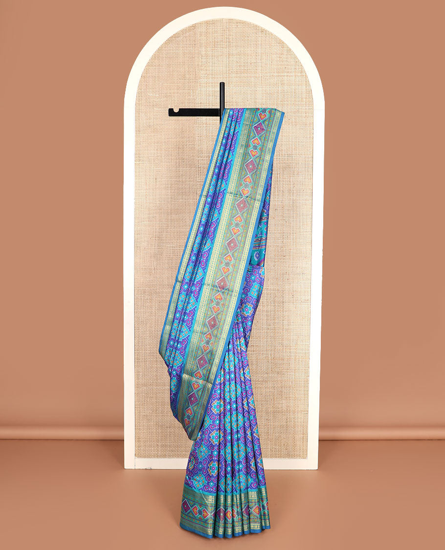 Blue ikkat design semi-banaras patola silk saree, traditional zari border of ikkat design, and ikkat design pallu