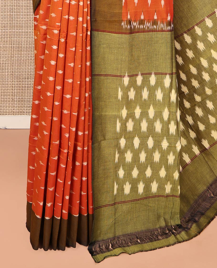 Orange Ikkat Cotton Saree, Accentuated with Ikkat-Style Buttas on Its Body, Complemented by Contrast Ikkat-Textured Border, Pallu Steeped with Ikkat Buttas, and Has No Blouse