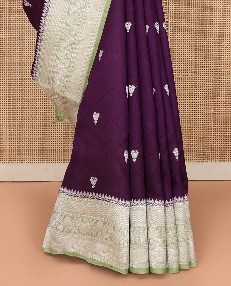 Purple Raw Mango Silk Saree Highlighted by Floral Buttas, Featuring a Contrast Traditional Zari Design Border, a Pallu Elevated with Chevron Stripes, Paired with a Contrast Brocade Blouse
