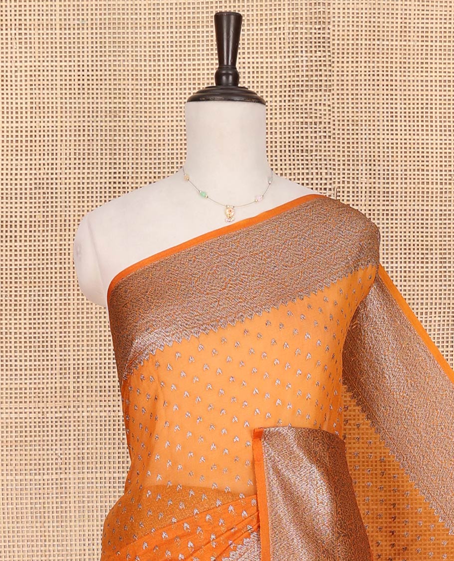 Orange Fancy Georgette Saree Decked Up with Zari Buttas, Hazily Zari Woven Border of Traditional Designs, Hazily Woven Pallu of Intricate Designs, and Paired with a Matching Blouse