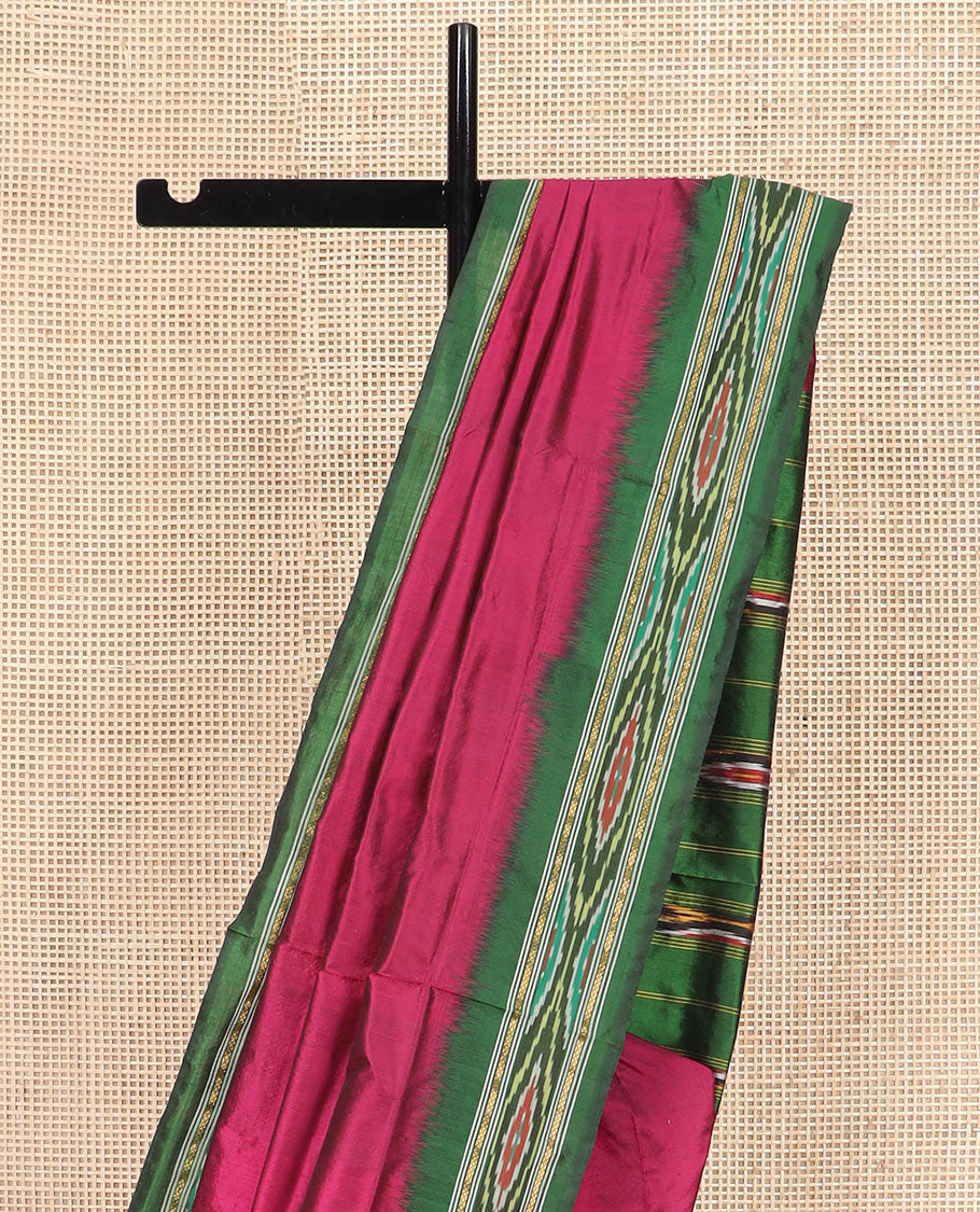 Magenta Plain Ikkat Silk Saree with a Contrast Green Border Complemented by a Hazy Ikkat Weave, Featuring a Pallu Flanked by Stripes and Ikkat Texture