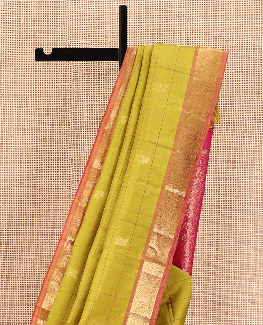 Green Kanchipuram Silk Saree, Sparsely Sparkled with Mayil Butta Enclosed Checked All Over Its Body, Complemented by a Contrast Traditional Zari Design Border, Pallu of Intricate Designs, and Paired with a Contrast Blouse