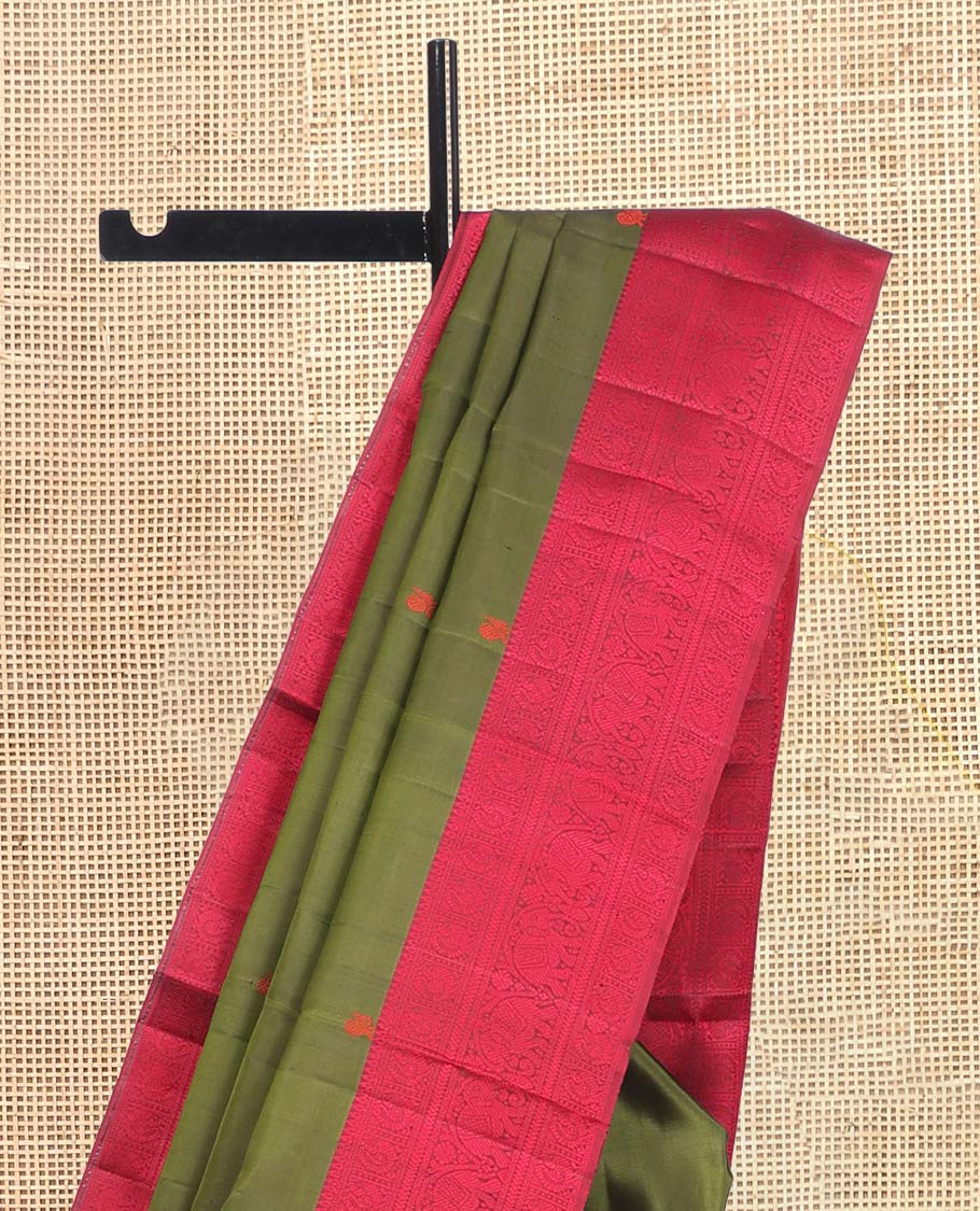 Green Kanchipuram Silk Saree, Delicately Woven with Mayil-Chakram Buttas, a Contrast Border of Thilakam, Kathir, Mayil, and Yaanai Designs, Thread-Woven Pallu, and a Contrast Blouse