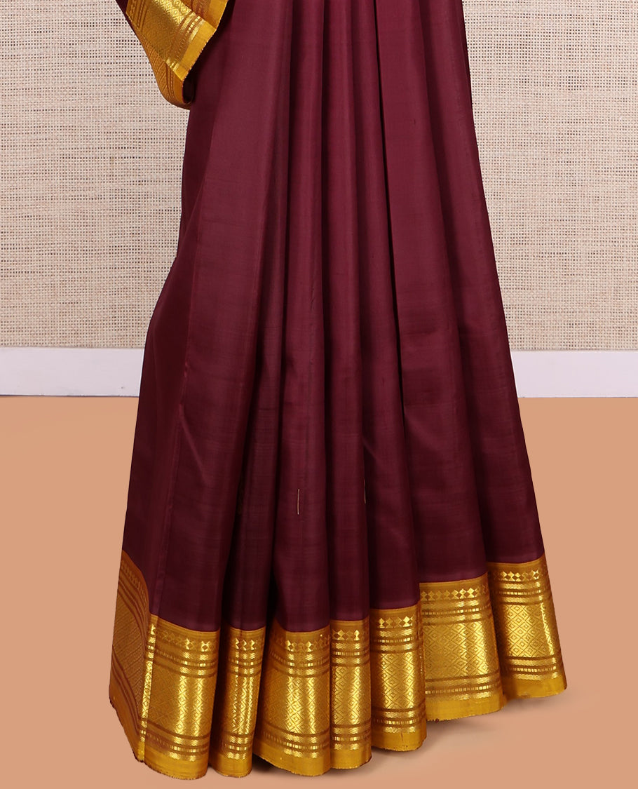 Maroon Kanchipuram Silk Saree, Accentuated with Zari Buttas, a Contrast One-Sided Border of Paneer Sombu, Rekku, Banaras, Muthu, and Mayil Kann Design, Zari Design Pallu, and No Blouse