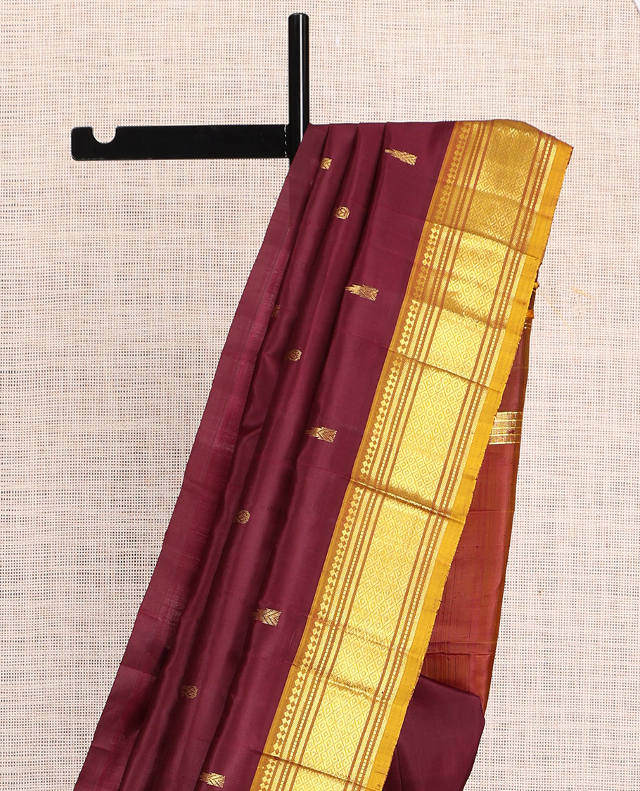 Maroon Kanchipuram Silk Saree, Accentuated with Zari Buttas, a Contrast One-Sided Border of Paneer Sombu, Rekku, Banaras, Muthu, and Mayil Kann Design, Zari Design Pallu, and No Blouse