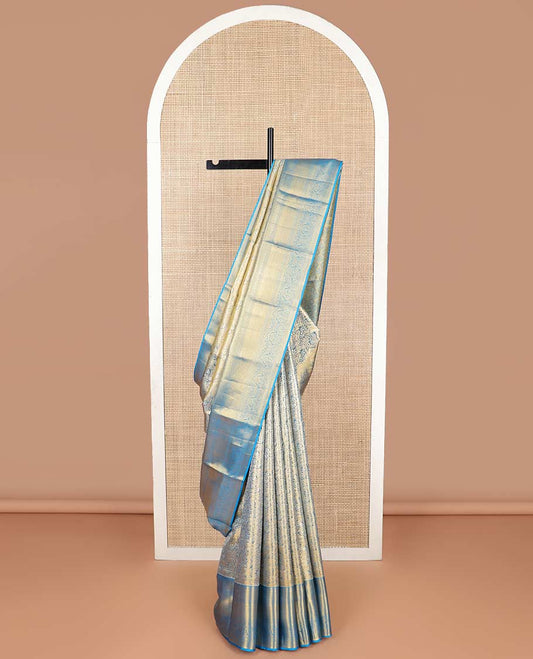 Blue floral jacquard kancheepuram tissue silk saree with contrast korvai border of thilakam mokku, kathir, mayil kann design & zari design pallu