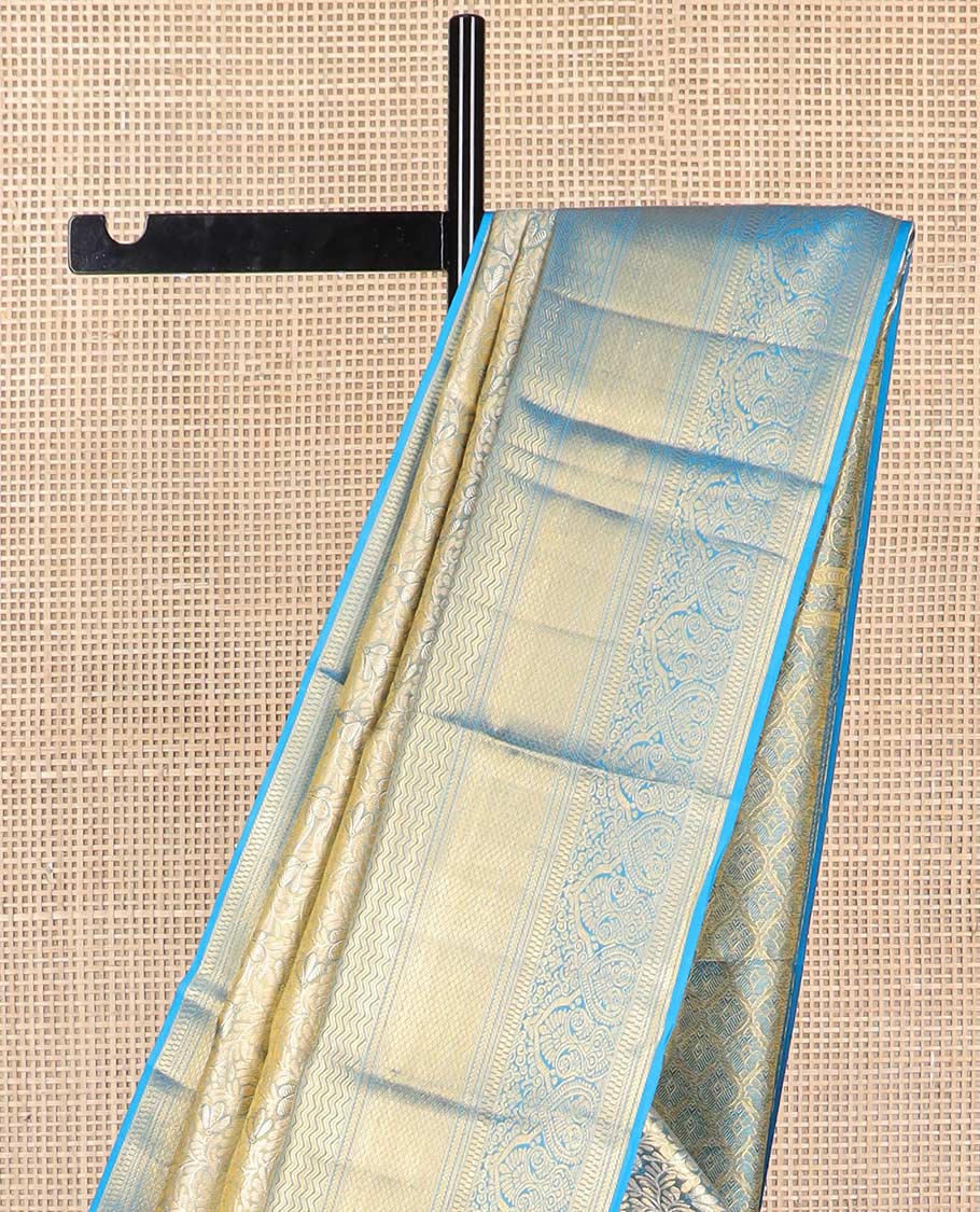 Blue floral jacquard kancheepuram tissue silk saree with contrast korvai border of thilakam mokku, kathir, mayil kann design & zari design pallu