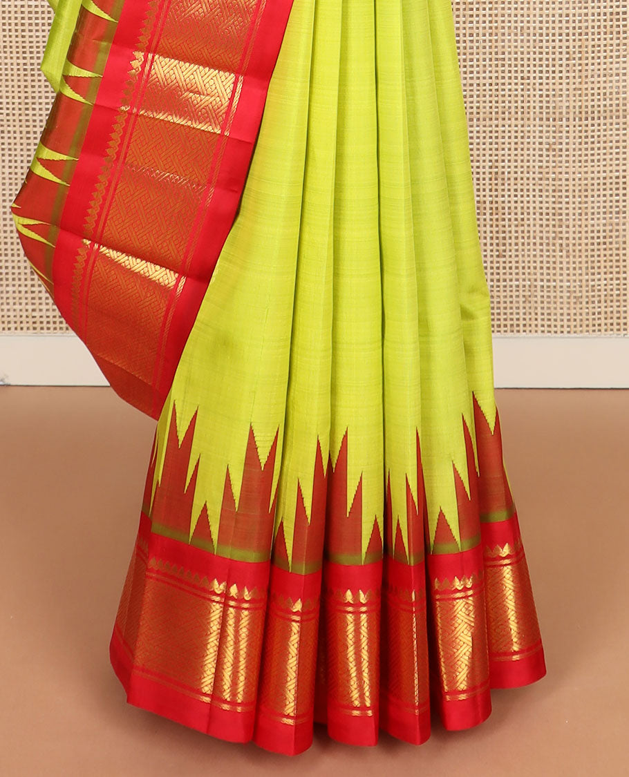 Green zari buttas Kanchipuram silk saree, contrast one-sided thazampoo rekku border of thilakam mokku & paayadi kann & zari design pallu