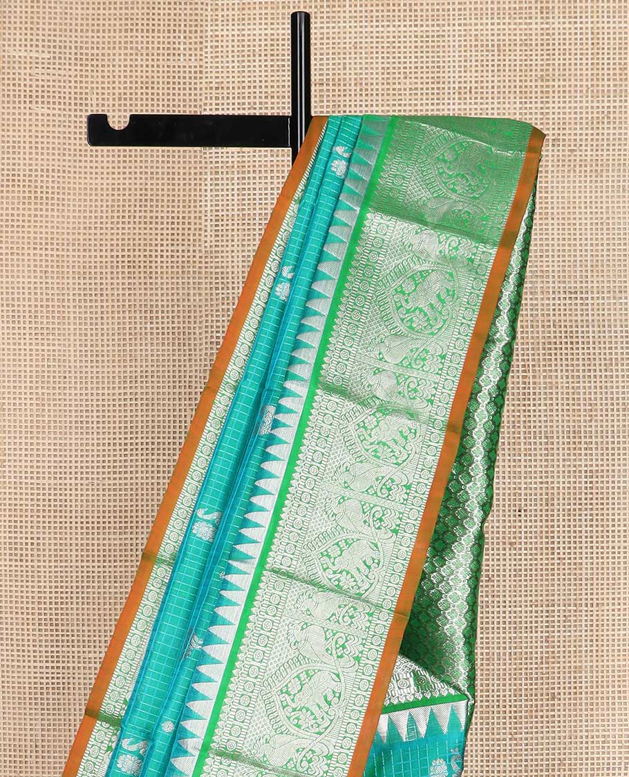 Green checked and zari buttas Kanchipuram silk saree, contrast border of rekku, salngai, muthu, chakram, kili designs, and jaal pallu